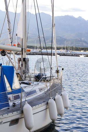 To use this stock image in your creative project, please select the size you need over to the right and click the "Add to Cart" button.
Your downloaded image will come with the Cutcaster watermark removed so don’t worry about the watermark you see on this page. Close up detail of sailing yacht stock photo, Close up detail of sailing yacht in port by Mark Yuill