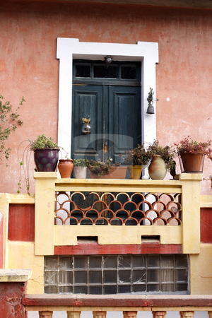 To use this stock image in your creative project, please select the size you need over to the right and click the "Add to Cart" button.
Your downloaded image will come with the Cutcaster watermark removed so don’t worry about the watermark you see on this page. Traditional painted entrance in Calvi Corsica stock photo, Traditional painted entrance with plant pots in Calvi Corsica by Mark Yuill