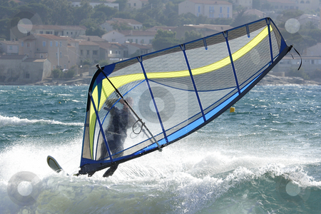 To use this stock image in your creative project, please select the size you need over to the right and click the "Add to Cart" button.
Your downloaded image will come with the Cutcaster watermark removed so don’t worry about the watermark you see on this page. Expert windsurfer in strong wind, surfing his board stock photo, Expert windsurfer in strong wind carving his board in waves by Mark Yuill
