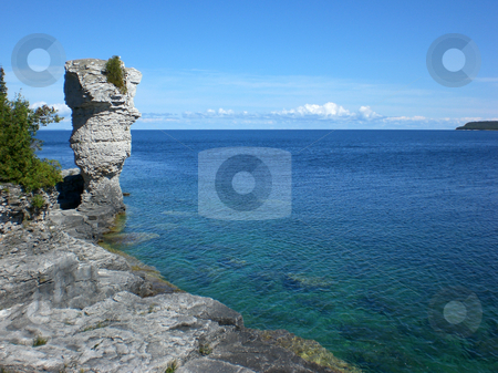 To use this stock image in your creative project, please select the size you need over to the right and click the "Add to Cart" button.
Your downloaded image will come with the Cutcaster watermark removed so don’t worry about the watermark you see on this page. Flowerpot on shoreline stock photo, by J.G. Byers