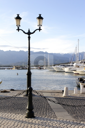 To use this stock image in your creative project, please select the size you need over to the right and click the "Add to Cart" button.
Your downloaded image will come with the Cutcaster watermark removed so don’t worry about the watermark you see on this page. View of Calvi port marina corsica stock photo, Quayside and marina in Calvi corsica by Mark Yuill
