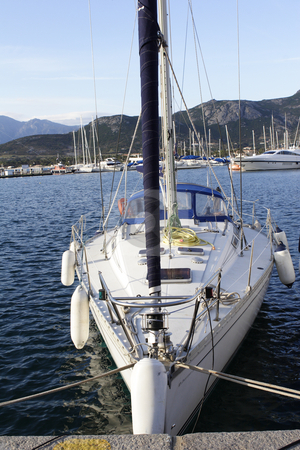 To use this stock image in your creative project, please select the size you need over to the right and click the "Add to Cart" button.
Your downloaded image will come with the Cutcaster watermark removed so don’t worry about the watermark you see on this page. Close up detail of sailing yacht stock photo, Close up detail of sailing yacht in port by Mark Yuill