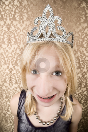 To use this stock image in your creative project, please select the size you need over to the right and click the "Add to Cart" button.
Your downloaded image will come with the Cutcaster watermark removed so don’t worry about the watermark you see on this page. Pretty young girl with a tiara with braces stock photo, Portrait of pretty young girl with braces wearing a tiara by Scott Griessel
