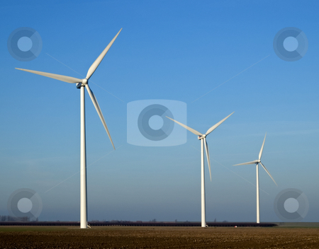 To use this stock image in your creative project, please select the size you need over to the right and click the "Add to Cart" button.
Your downloaded image will come with the Cutcaster watermark removed so don’t worry about the watermark you see on this page. Electricity mills stock photo, Three mills for wind energy in landscape by Wino Evertz