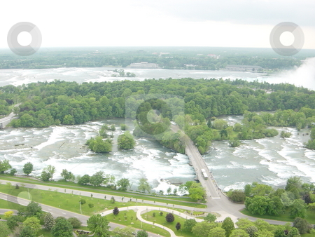 To use this stock image in your creative project, please select the size you need over to the right and click the "Add to Cart" button.
Your downloaded image will come with the Cutcaster watermark removed so don’t worry about the watermark you see on this page. Niagara Falls - border of USA stock photo, by Ritu Jethani