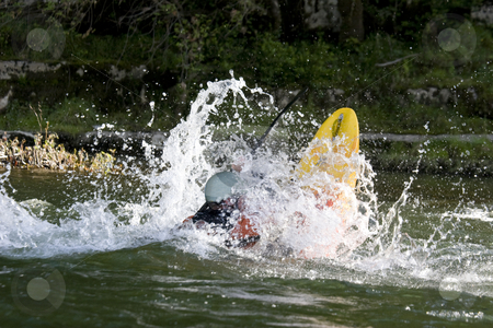 To use this stock image in your creative project, please select the size you need over to the right and click the "Add to Cart" button.
Your downloaded image will come with the Cutcaster watermark removed so don’t worry about the watermark you see on this page. Dynamic white water kayak action stock photo, Expert white water kayak paddler performing tricks by Mark Yuill