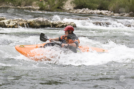 To use this stock image in your creative project, please select the size you need over to the right and click the "Add to Cart" button.
Your downloaded image will come with the Cutcaster watermark removed so don’t worry about the watermark you see on this page. Whitewater kayaking stock photo, Whitewater kayaker surfing a wave on grade 3 rapid by Mark Yuill