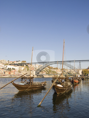 To use this stock image in your creative project, please select the size you need over to the right and click the "Add to Cart" button.
Your downloaded image will come with the Cutcaster watermark removed so don’t worry about the watermark you see on this page. Tradicional rebelo boat stock photo, Cityscape with a typical portowine rebelo boat in the forground by Paulo Resende