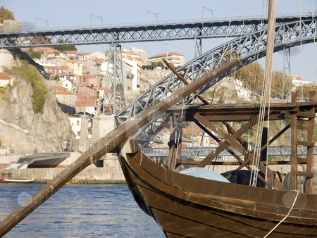 To use this stock image in your creative project, please select the size you need over to the right and click the "Add to Cart" button.
Your downloaded image will come with the Cutcaster watermark removed so don’t worry about the watermark you see on this page. Tradicional rebelo boat stock photo, Cityscape with a typical portowine rebelo boat in the forground by Paulo Resende