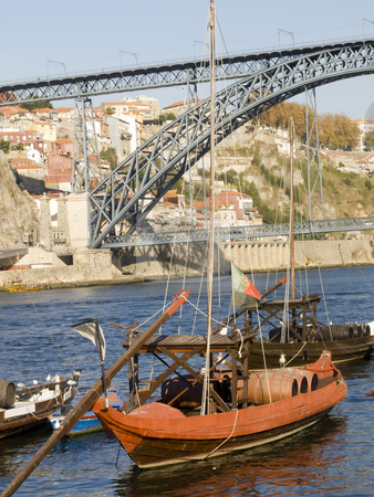 To use this stock image in your creative project, please select the size you need over to the right and click the "Add to Cart" button.
Your downloaded image will come with the Cutcaster watermark removed so don’t worry about the watermark you see on this page. Tradicional rebelo boat stock photo, Cityscape with a typical portowine rebelo boat in the forground by Paulo Resende