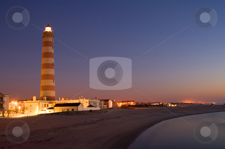 To use this stock image in your creative project, please select the size you need over to the right and click the "Add to Cart" button.
Your downloaded image will come with the Cutcaster watermark removed so don’t worry about the watermark you see on this page. Lighthouse in Aveiro in Portugal stock photo, Lighthouse in Aveiro in Portugal - Barra beach at night by Paulo Resende