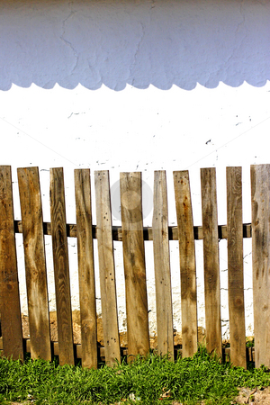 To use this stock image in your creative project, please select the size you need over to the right and click the "Add to Cart" button.
Your downloaded image will come with the Cutcaster watermark removed so don’t worry about the watermark you see on this page. Old wooden fence stock photo, Old wooden fence and wall by Mark Yuill