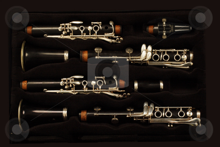 To use this stock image in your creative project, please select the size you need over to the right and click the "Add to Cart" button.
Your downloaded image will come with the Cutcaster watermark removed so don’t worry about the watermark you see on this page. Clarinet stock photo, Close up detail of a woodwind clarinet by Mark Yuill