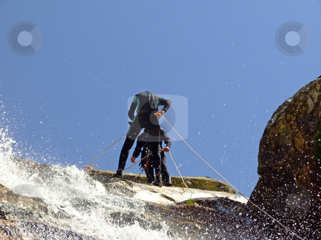 To use this stock image in your creative project, please select the size you need over to the right and click the "Add to Cart" button.
Your downloaded image will come with the Cutcaster watermark removed so don’t worry about the watermark you see on this page. Men preparing to descend stock photo, Men preparing to descend waterfall by Paulo Resende