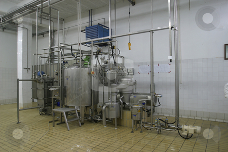To use this stock image in your creative project, please select the size you need over to the right and click the "Add to Cart" button.
Your downloaded image will come with the Cutcaster watermark removed so don’t worry about the watermark you see on this page. Temperature controlled tanks and pipes in modern dairy stock photo, Stainless steel temperature controlled tanks and pipes in modern dairy by Mark Yuill