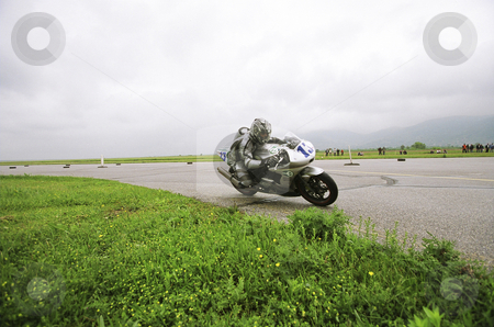 To use this stock image in your creative project, please select the size you need over to the right and click the "Add to Cart" button.
Your downloaded image will come with the Cutcaster watermark removed so don’t worry about the watermark you see on this page. Motorcycle racing stock photo, Motorbike racing by Mark Yuill