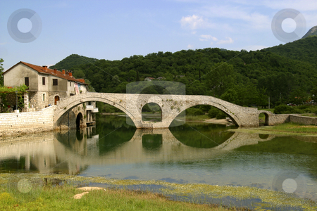 To use this stock image in your creative project, please select the size you need over to the right and click the "Add to Cart" button.
Your downloaded image will come with the Cutcaster watermark removed so don’t worry about the watermark you see on this page. Stone bridge in montenegro stock photo, Old stone bridge in montenegro by Mark Yuill