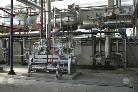 To use this stock image in your creative project, please select the size you need over to the right and click the "Add to Cart" button.
Your downloaded image will come with the Cutcaster watermark removed so don’t worry about the watermark you see on this page. Indusrial component in factory stock photo, Indusrial compressors and pipe work in factory by Mark Yuill