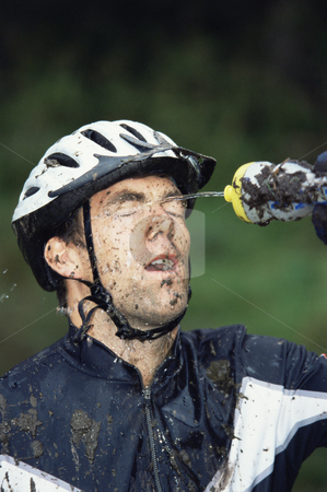To use this stock image in your creative project, please select the size you need over to the right and click the "Add to Cart" button.
Your downloaded image will come with the Cutcaster watermark removed so don’t worry about the watermark you see on this page. Mountain biker refreshing stock photo, by Monkey Business Images
