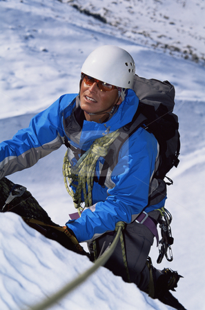 To use this stock image in your creative project, please select the size you need over to the right and click the "Add to Cart" button.
Your downloaded image will come with the Cutcaster watermark removed so don’t worry about the watermark you see on this page. Young man mountain climbing on snowy peak stock photo, by Monkey Business Images
