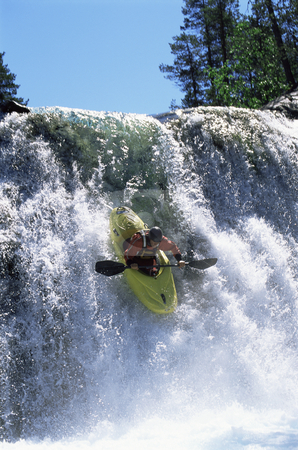 To use this stock image in your creative project, please select the size you need over to the right and click the "Add to Cart" button.
Your downloaded image will come with the Cutcaster watermark removed so don’t worry about the watermark you see on this page. Young man kayaking down waterfall stock photo, by Monkey Business Images