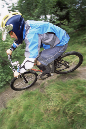 To use this stock image in your creative project, please select the size you need over to the right and click the "Add to Cart" button.
Your downloaded image will come with the Cutcaster watermark removed so don’t worry about the watermark you see on this page. Young man mountain biking stock photo, by Monkey Business Images