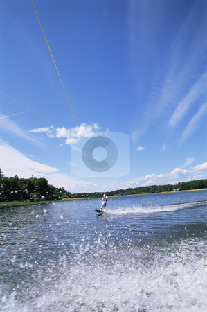 To use this stock image in your creative project, please select the size you need over to the right and click the "Add to Cart" button.
Your downloaded image will come with the Cutcaster watermark removed so don’t worry about the watermark you see on this page. A young woman water skiing stock photo, by Monkey Business Images