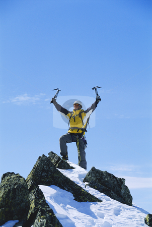 To use this stock image in your creative project, please select the size you need over to the right and click the "Add to Cart" button.
Your downloaded image will come with the Cutcaster watermark removed so don’t worry about the watermark you see on this page. Mountain climber stock photo, Young man celebrating reaching the top of a mountain by Monkey Business Images
