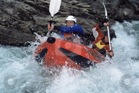 To use this stock image in your creative project, please select the size you need over to the right and click the "Add to Cart" button.
Your downloaded image will come with the Cutcaster watermark removed so don’t worry about the watermark you see on this page. White water rafting stock photo, Two people paddling inflatable boat down rapids by Monkey Business Images