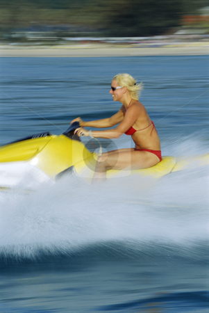 To use this stock image in your creative project, please select the size you need over to the right and click the "Add to Cart" button.
Your downloaded image will come with the Cutcaster watermark removed so don’t worry about the watermark you see on this page. A woman on a jet ski stock photo, A woman on a jet ski by Monkey Business Images