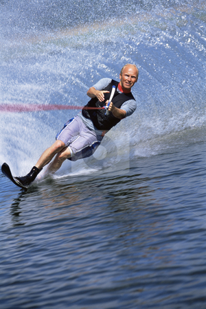 To use this stock image in your creative project, please select the size you need over to the right and click the "Add to Cart" button.
Your downloaded image will come with the Cutcaster watermark removed so don’t worry about the watermark you see on this page. Water skiing stock photo, A young man water skiing by Monkey Business Images