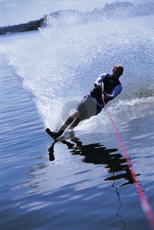 To use this stock image in your creative project, please select the size you need over to the right and click the "Add to Cart" button.
Your downloaded image will come with the Cutcaster watermark removed so don’t worry about the watermark you see on this page. Water skiing stock photo, A young man water skiing by Monkey Business Images
