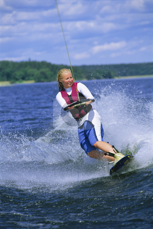 To use this stock image in your creative project, please select the size you need over to the right and click the "Add to Cart" button.
Your downloaded image will come with the Cutcaster watermark removed so don’t worry about the watermark you see on this page. A young woman water skiing stock photo, A young woman water skiing by Monkey Business Images