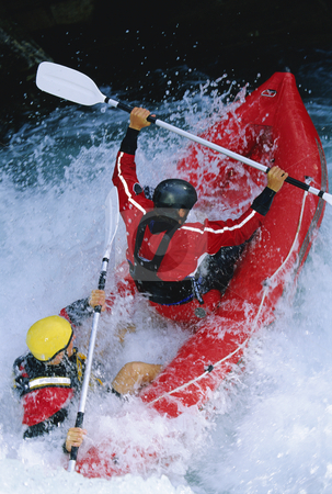To use this stock image in your creative project, please select the size you need over to the right and click the "Add to Cart" button.
Your downloaded image will come with the Cutcaster watermark removed so don’t worry about the watermark you see on this page. White water rafting stock photo, Two people paddling inflatable boat down rapids by Monkey Business Images