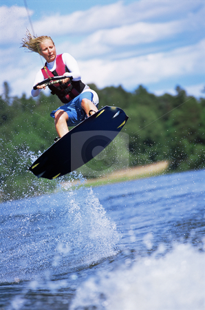 To use this stock image in your creative project, please select the size you need over to the right and click the "Add to Cart" button.
Your downloaded image will come with the Cutcaster watermark removed so don’t worry about the watermark you see on this page. A young woman water skiing stock photo, A young woman water skiing by Monkey Business Images