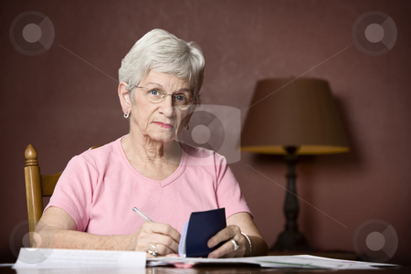 To use this stock image in your creative project, please select the size you need over to the right and click the "Add to Cart" button.
Your downloaded image will come with the Cutcaster watermark removed so don’t worry about the watermark you see on this page. Senior woman paying bills stock photo, Senior woman with many bills and notices by Scott Griessel