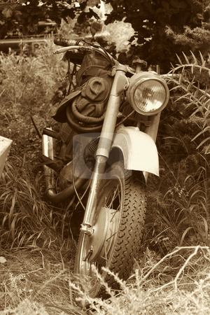 To use this stock image in your creative project, please select the size you need over to the right and click the "Add to Cart" button.
Your downloaded image will come with the Cutcaster watermark removed so don’t worry about the watermark you see on this page. Classic old motorcycle stock photo, Classic old motorcycle in parked in countryside by Mark Yuill