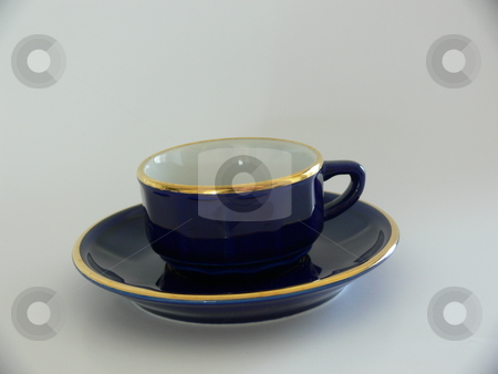 To use this stock image in your creative project, please select the size you need over to the right and click the "Add to Cart" button.
Your downloaded image will come with the Cutcaster watermark removed so don’t worry about the watermark you see on this page. Coffee Cup stock photo, A dark blue gold-rimmed espresso cup sitting on a matching saucer. Isolated on a grey/white background by Martin Darley