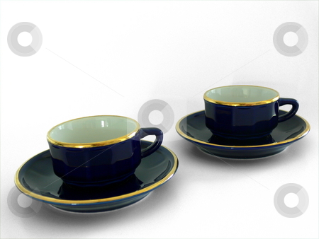 To use this stock image in your creative project, please select the size you need over to the right and click the "Add to Cart" button.
Your downloaded image will come with the Cutcaster watermark removed so don’t worry about the watermark you see on this page. Coffee Cups stock photo, Two dark blue gold-rimmed espresso cups sitting on matching saucers; on a grey/white background by Martin Darley