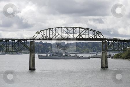 To use this stock image in your creative project, please select the size you need over to the right and click the "Add to Cart" button.
Your downloaded image will come with the Cutcaster watermark removed so don’t worry about the watermark you see on this page. Manette Bridge stock photo, April 14, 2004 : The Turner Joy military ship could be seen underneath the Manette Bridge in Bremerton, Washington. The Turner Joy is now station in Bremerton as a tourist visiting boat. by Jesse Beals