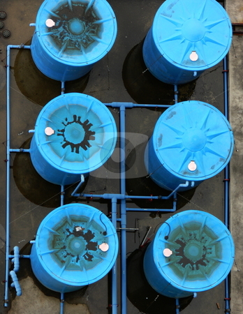 To use this stock image in your creative project, please select the size you need over to the right and click the "Add to Cart" button.
Your downloaded image will come with the Cutcaster watermark removed so don’t worry about the watermark you see on this page. Rootop water tanks stock photo, Blue, industrial sized rooftop water tanks, shot from above by Martin Darley
