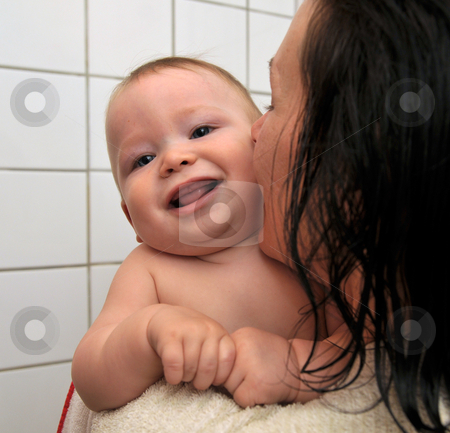 To use this stock image in your creative project, please select the size you need over to the right and click the "Add to Cart" button.
Your downloaded image will come with the Cutcaster watermark removed so don’t worry about the watermark you see on this page. Baby and mother in shower room stock photo, Baby boy and mother together in shower room after shower by Johan Lenell