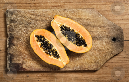 To use this stock image in your creative project, please select the size you need over to the right and click the "Add to Cart" button.
Your downloaded image will come with the Cutcaster watermark removed so don’t worry about the watermark you see on this page. Papaya fruit sliced stock photo, Papaya fruit sliced on a wooden cutting table by Pablo Caridad