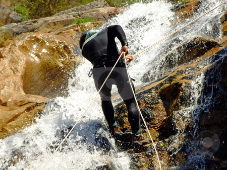 To use this stock image in your creative project, please select the size you need over to the right and click the "Add to Cart" button.
Your downloaded image will come with the Cutcaster watermark removed so don’t worry about the watermark you see on this page. Men descending on rappel stock photo, Men descending waterfall in Portugal by Paulo Resende