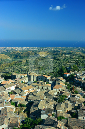 To use this stock image in your creative project, please select the size you need over to the right and click the "Add to Cart" button.
Your downloaded image will come with the Cutcaster watermark removed so don’t worry about the watermark you see on this page. Gerace stock photo, Look on Gerace, olive garden, Locri, and horizon over the sea. Gerace is a medieval city in Calabria (Southern Italy) with around 20 active churches. by Natalia Macheda