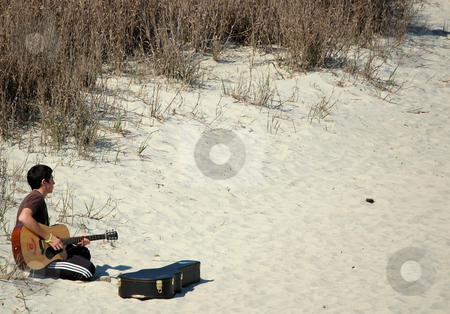 To use this stock image in your creative project, please select the size you need over to the right and click the "Add to Cart" button.
Your downloaded image will come with the Cutcaster watermark removed so don’t worry about the watermark you see on this page. Beach Musician stock photo, by Liane Harrold
