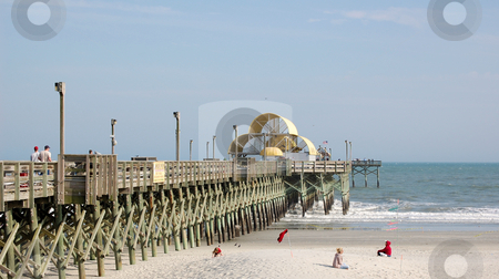 To use this stock image in your creative project, please select the size you need over to the right and click the "Add to Cart" button.
Your downloaded image will come with the Cutcaster watermark removed so don’t worry about the watermark you see on this page. Pier at beach stock photo, by Liane Harrold