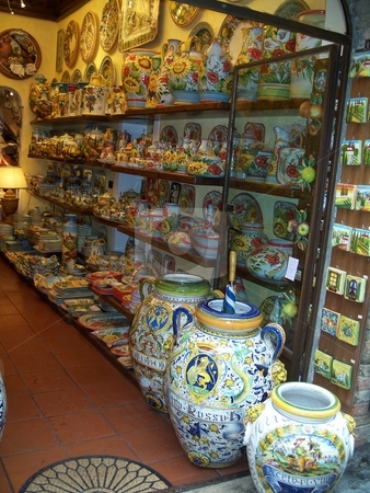 To use this stock image in your creative project, please select the size you need over to the right and click the "Add to Cart" button.
Your downloaded image will come with the Cutcaster watermark removed so don’t worry about the watermark you see on this page. China Shop stock photo, A Collection of pottery and china in a shop in Italy by Andy C