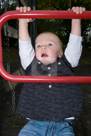 To use this stock image in your creative project, please select the size you need over to the right and click the "Add to Cart" button.
Your downloaded image will come with the Cutcaster watermark removed so don’t worry about the watermark you see on this page. Do the cheeky funky monkey stock photo, A little boy chinning the bar at the playground by Alexander L?