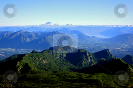 To use this stock image in your creative project, please select the size you need over to the right and click the "Add to Cart" button.
Your downloaded image will come with the Cutcaster watermark removed so don’t worry about the watermark you see on this page. Lake District in Chile stock photo, The mountain range of the lake district in south Chile by Rafael Franceschini